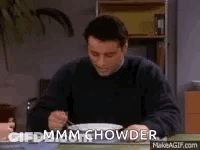 Man Sitting At Table With Bowl Of Soup And Fork GIF