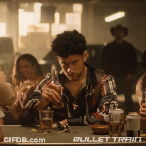 Man Sitting At Table With Bullet Train GIF