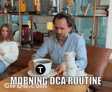 Man Sitting At Table With Coffee Cups Morning Dca Routine GIF