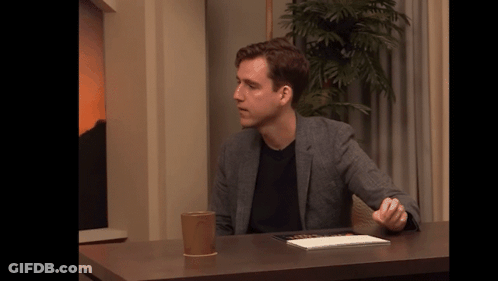 Man Sitting At Table With Coffee GIF