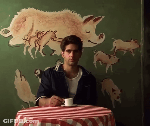 Man Sitting At Table With Coffee GIF