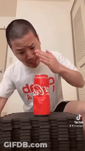 Man Sitting At Table With Dominoes And Coca-Cola GIF