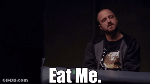 Man Sitting At Table With Eat Me GIF