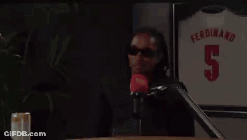 Man Sitting At Table With Ferdinand 5 Jersey GIF