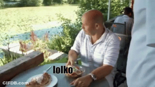 Man Sitting At Table With Food Saying Lolko GIF