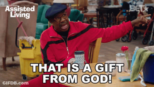 Man Sitting At Table With Gift From God GIF