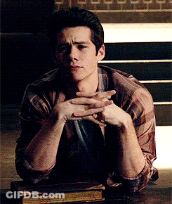 Man Sitting At Table With Hands Folded GIF