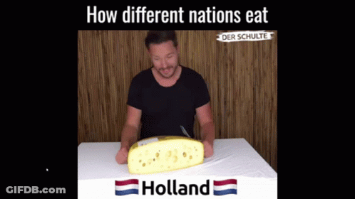 Man Sitting At Table With Holland Cheese GIF