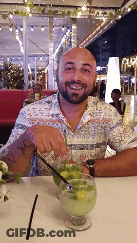 Man Sitting At Table With I Love Drink GIF