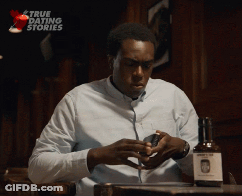 Man Sitting At Table With John's Gin GIF