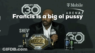 Man Sitting At Table With Microphone And UFC Belt GIF