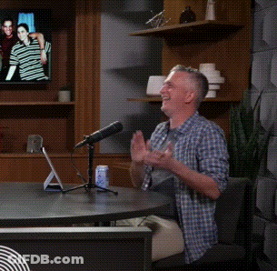 Man Sitting At Table With Microphone And Yes GIF
