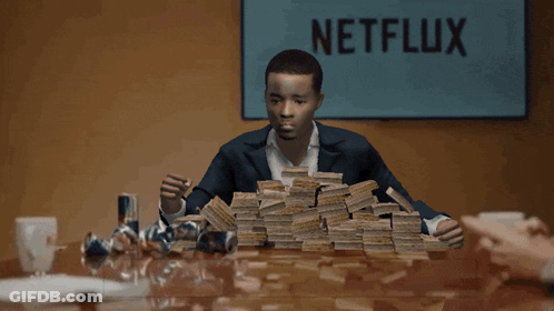 Man Sitting At Table With Money GIF