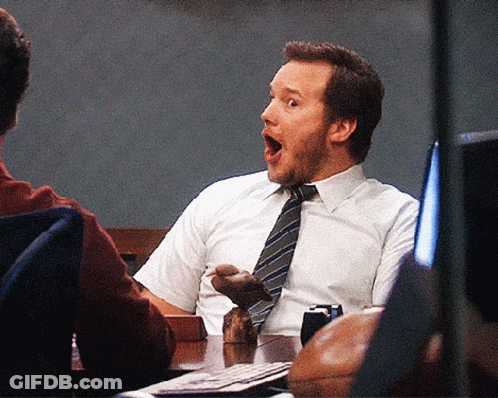 Man Sitting At Table With Mouth Open GIF