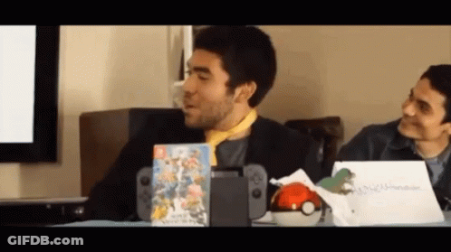Man Sitting At Table With Nintendo Switch And Game GIF