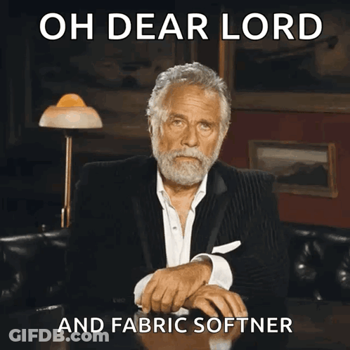 Man Sitting At Table With Oh Dear Lord And Fabric Softener GIF