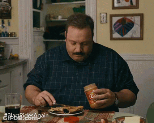 Man Sitting At Table With Plate And Peanut Butter GIF