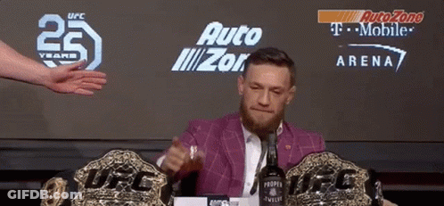Man Sitting At Table With Proper Twelve Bottle GIF