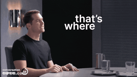 Man Sitting At Table With Text GIF