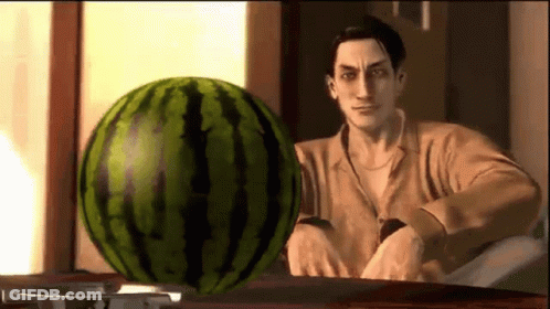 Man Sitting At Table With Watermelon GIF
