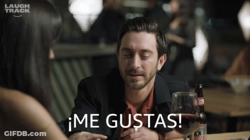 Man Sitting At Table With Wine And Laugh Track Logo GIF