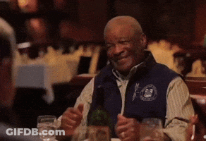 Man Sitting At Table With Wine Bottle GIF