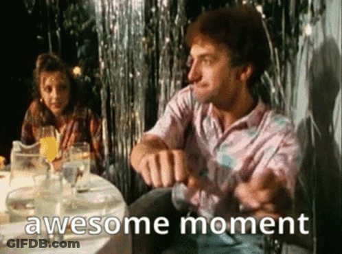 Man Sitting At Table With Woman Behind GIF