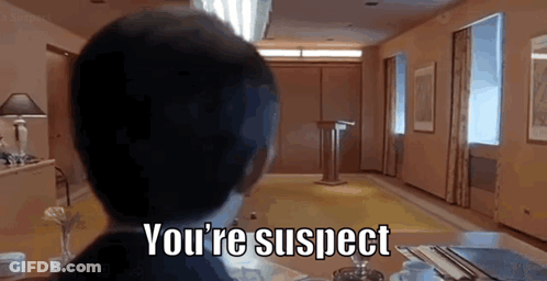 Man Sitting At Table You're Suspect GIF