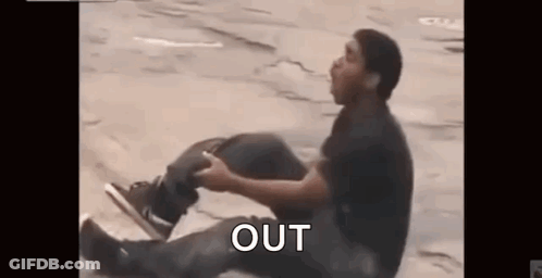 Man Sitting Cross-Legged Saying Out GIF