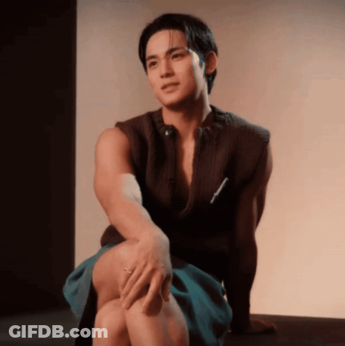 Man Sitting Crossed Legs Hand On Leg GIF