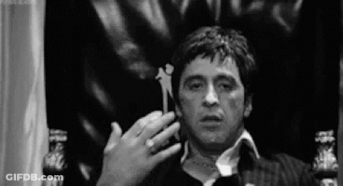 Man Sitting Holding Paper GIF