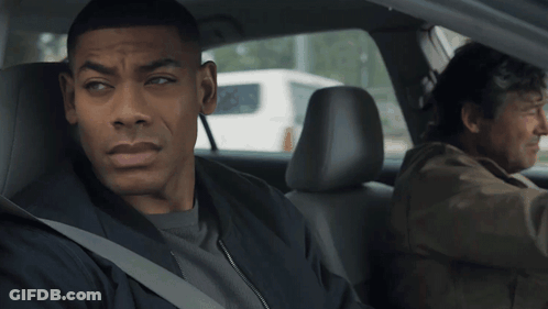 Man Sitting In Back Seat While Another Man Drives GIF