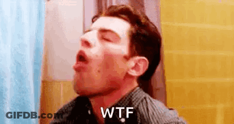 Man Sitting In Bathroom Saying WTF GIF