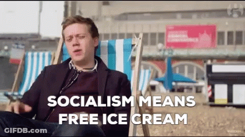 Man Sitting In Beach Chair Saying Socialism Means Free Ice Cream GIF