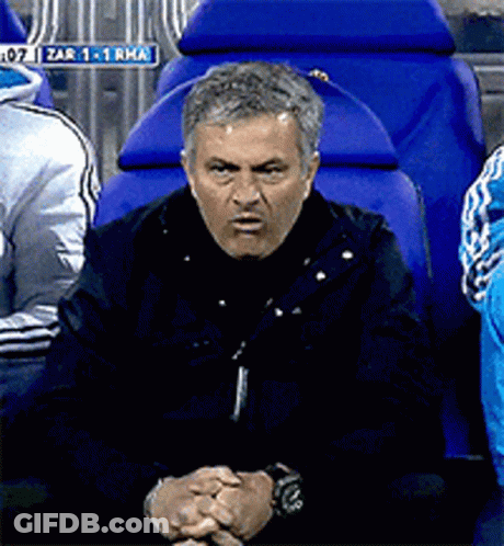 Man Sitting In Blue Chair With Zar Sign GIF