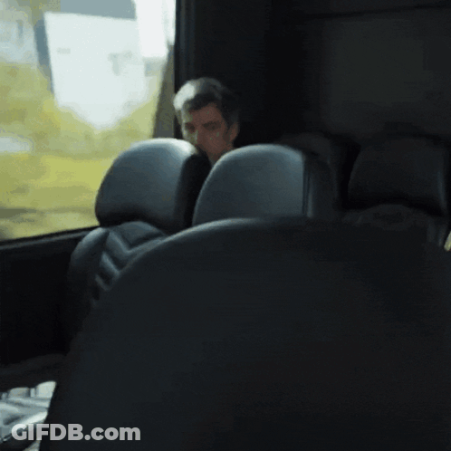 Man Sitting In Bus Looking Out Window GIF