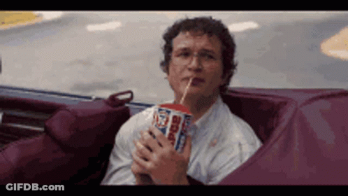 Man Sitting In Car Drinking Soda Through Straw GIF