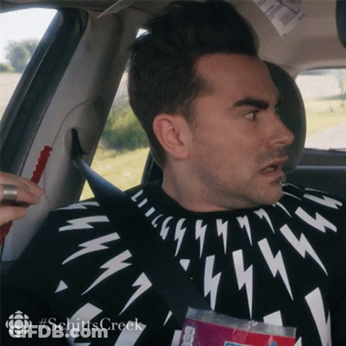 Man Sitting In Car In Black And White Lightning Bolt Sweater GIF
