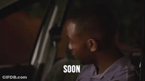 Man Sitting In Car With Glowing Eyes And Soon On Face GIF