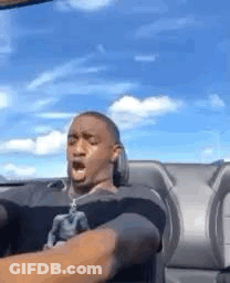 Man Sitting In Car With Mouth Open Blue Sky GIF