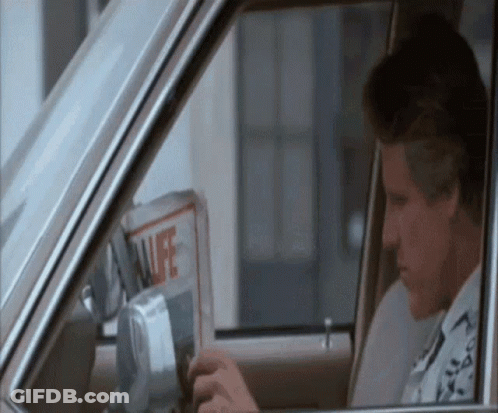 Man Sitting In Car With Newspaper GIF