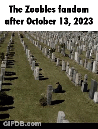 Man Sitting In Cemetery With Zoobles Fandom After October 13 2023 GIF