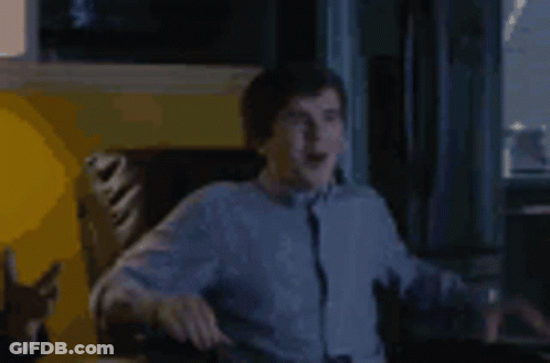 Man Sitting In Chair Arms Outstretched GIF