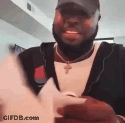 Man Sitting In Chair By Avengers Poster GIF