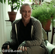 Man Sitting In Chair By Window With Potted Plants GIF