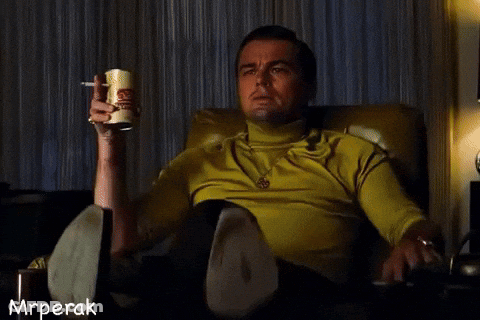 Man Sitting In Chair Holding Beer And Pointing GIF