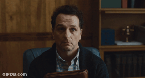 Man Sitting In Chair Holding Briefcase GIF