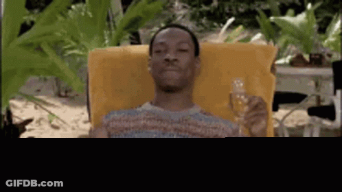 Man Sitting In Chair Holding Champagne Vacation Mode GIF