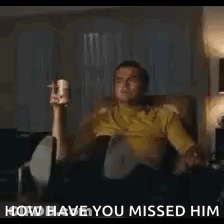 Man Sitting In Chair Holding Cup And Remote GIF