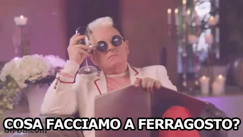 Man Sitting In Chair Holding Wine Cosa Facciamo A Ferragosto GIF